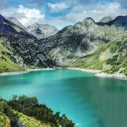 Scenic view of lake by mountains