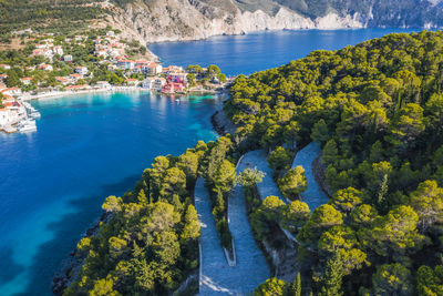 High angle view of trees by sea