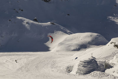 People skiing on snow covered land