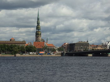 Panoramic view of sea by city against sky