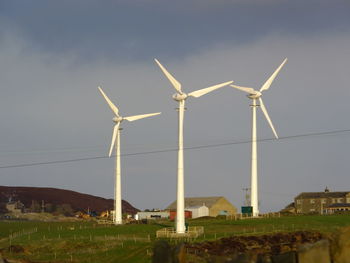 Wind turbines on field