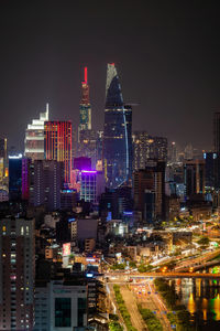 Illuminated buildings in city at night