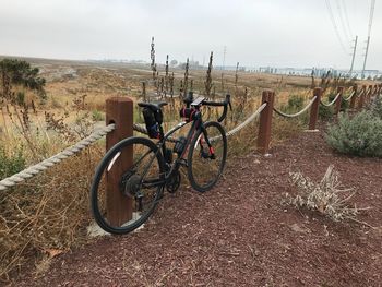 Bicycle on field against sky