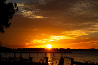 Scenic view of sea against orange sky