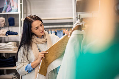 Beautiful woman shopping in store