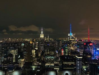 Illuminated buildings in city at night