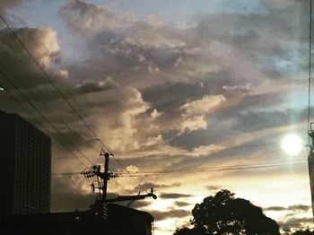 Low angle view of silhouette building against sky during sunset