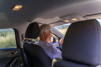 Senior man driving a car