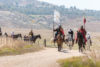 Group of people riding horses