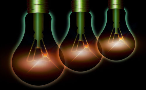 Digital composite image of illuminated light bulb