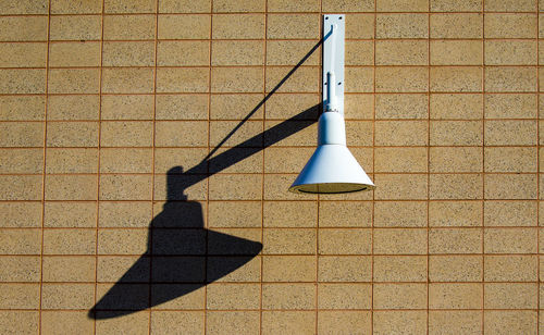 High angle view of shadow on tiled floor