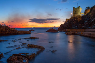 Scenic view of sea against sky during sunset