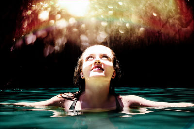 Young woman swimming in pool