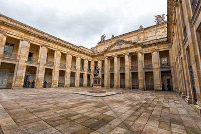 View of historical building against cloudy sky