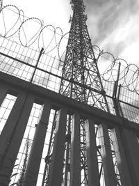 Low angle view of communications tower against sky