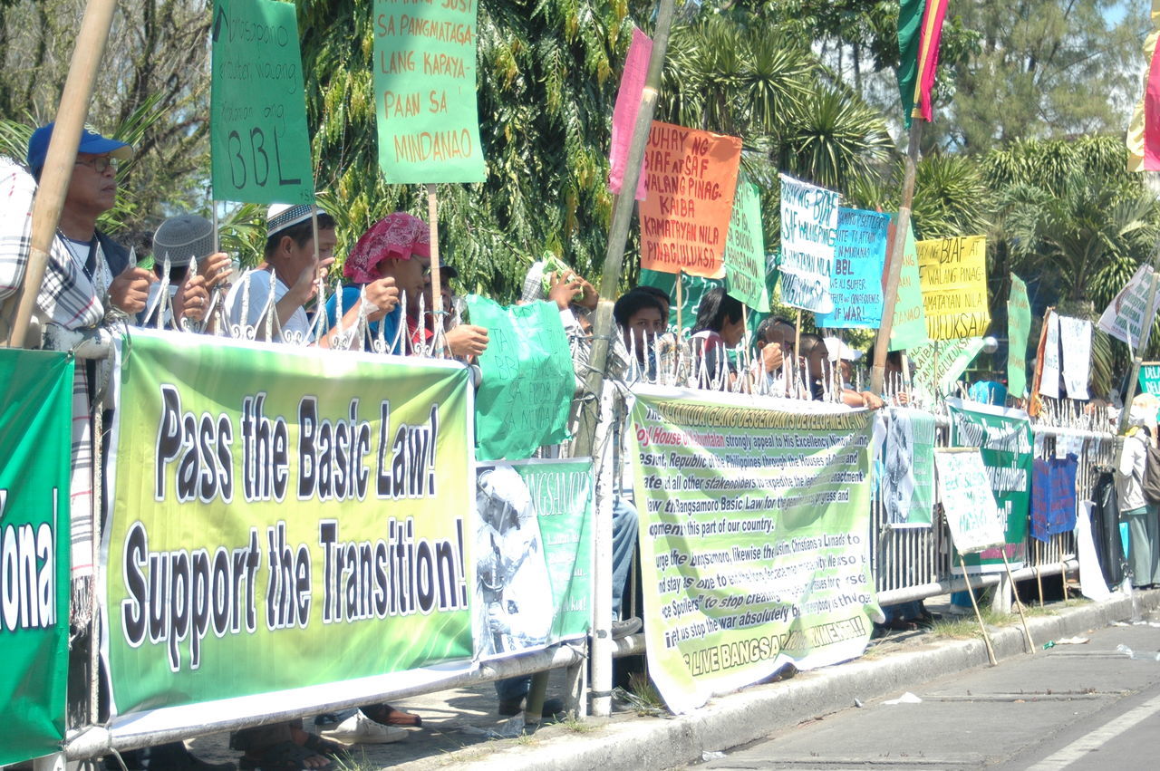 GROUP OF PEOPLE AT STREET