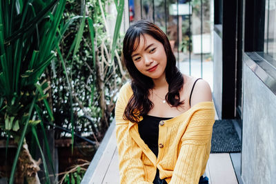 Smiling woman looking away outdoors