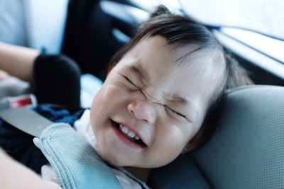 Close-up of toddler making a funny face