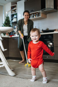 Full length portrait of happy boy smiling