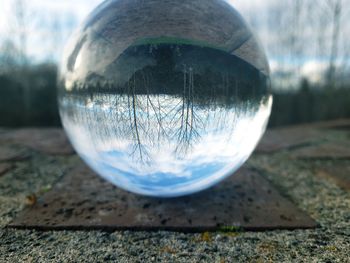 Close-up of crystal ball on field