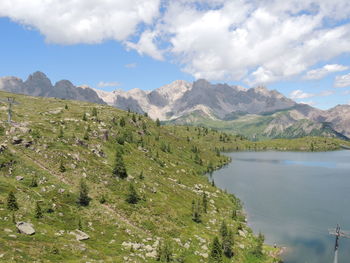 Scenic view of lake and mountains against sky