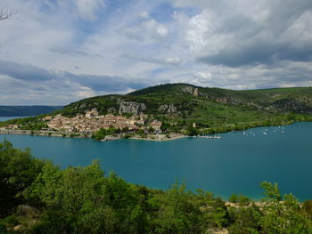 Scenic view of lake and mountains against sky