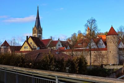 Panoramic view of trees and buildings against sky