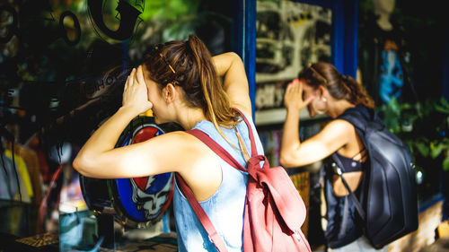 Young woman standing in park