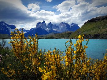 Scenic view of sea and mountains against sky