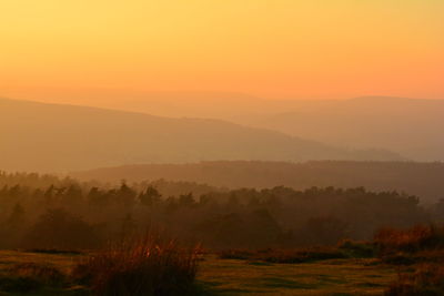 Scenic view of mountains against sky during sunset