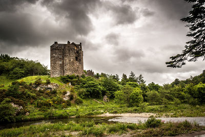 View of old ruin building against cloudy sky