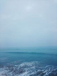 Scenic view of sea against sky during winter