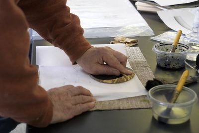 Close-up of man working on table