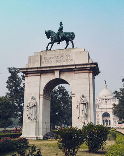 A picture of the victoria memorial gate captured in broad daylight and grid in lightroom
