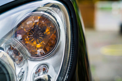 Close-up of headlights of car