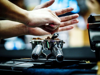 Cropped hand of man playing guitar