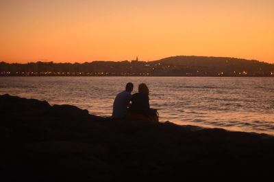 Silhouette of people at sunset