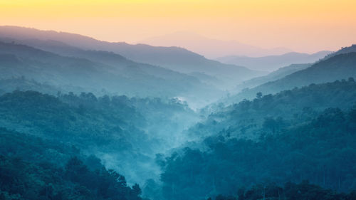 Scenic view of mountains against sky during sunset