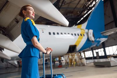Low angle view of man standing on airport