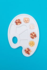 High angle view of ice cream over blue background