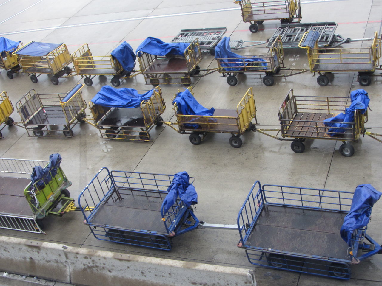 HIGH ANGLE VIEW OF WORKER WORKING AT AIRPLANE