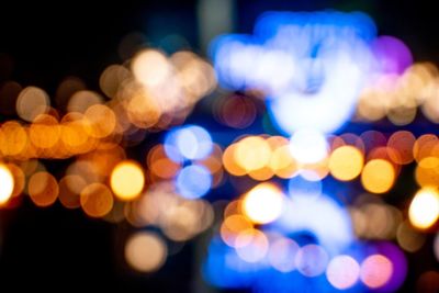 Defocused image of illuminated lights at night