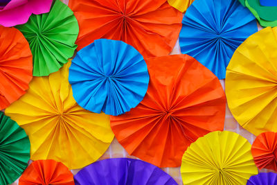 Low angle view of multi colored umbrellas at market stall