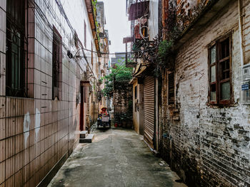 Narrow alley along buildings