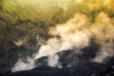 Smoke emitting from volcanic mountain