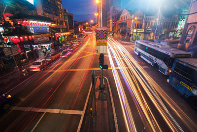 Illuminated city street at night