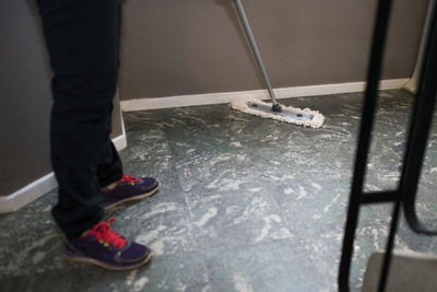 Woman mopping floor