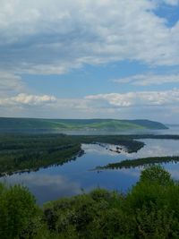 Scenic view of volga river against cloudy sky