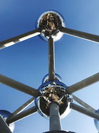 Low angle view of ferris wheel against sky