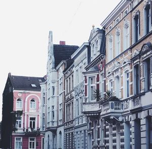 Low angle view of buildings against clear sky
